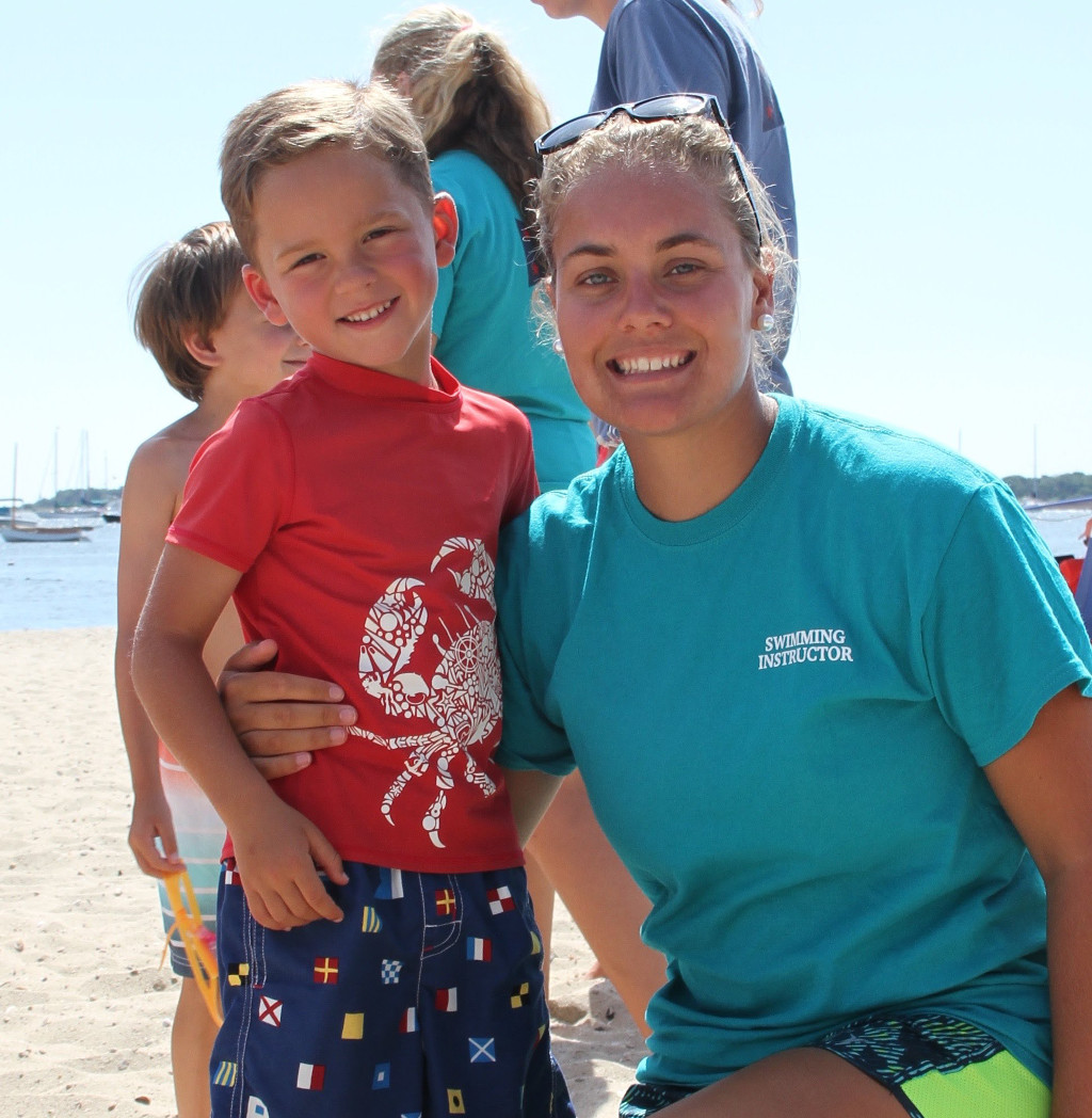 Young child with swim instructor